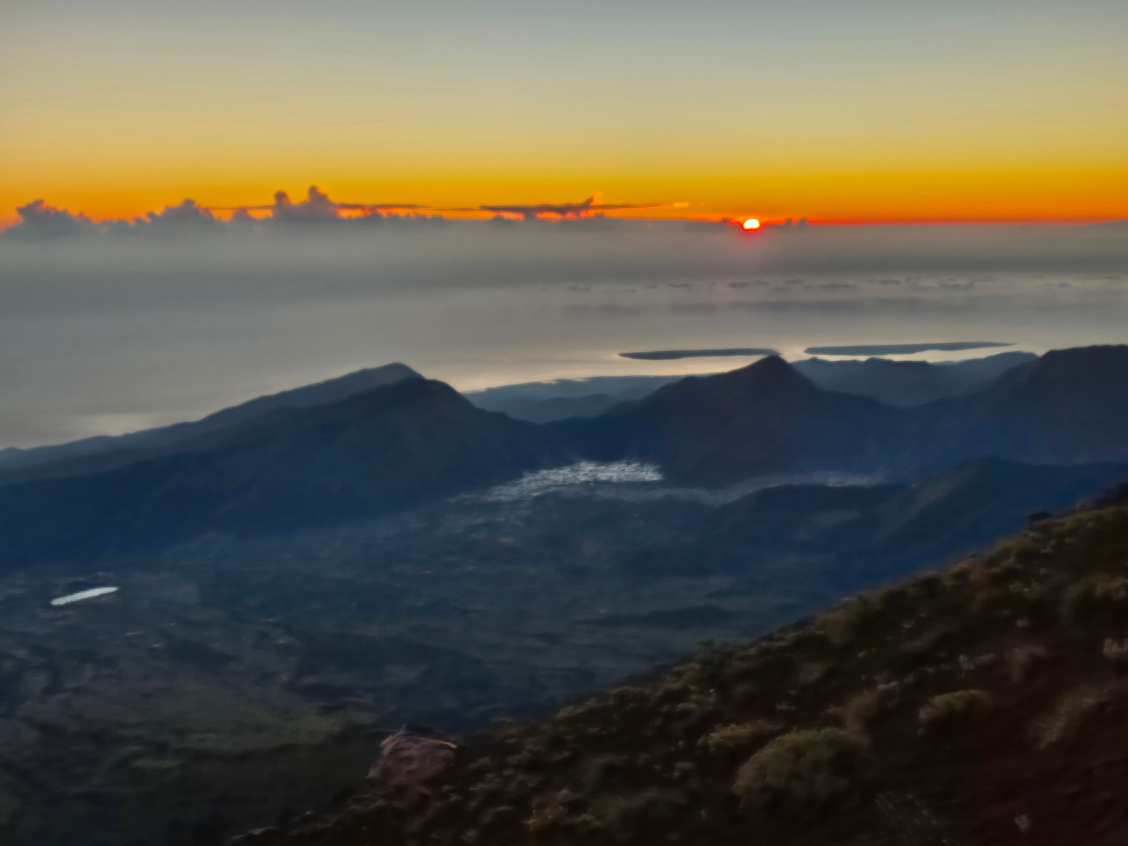 View on Sembalun from the path to the summit of Rinjani at sunrise.